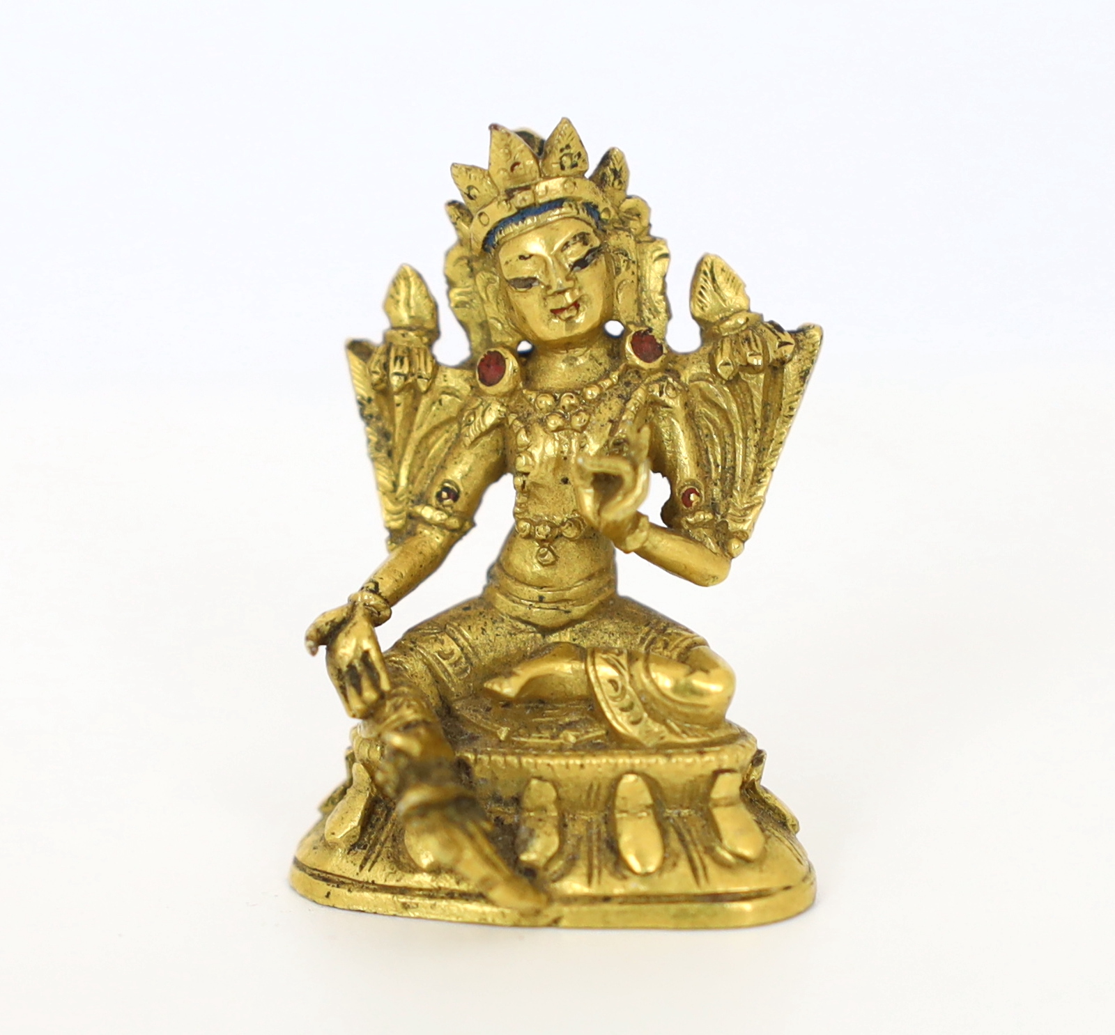 A Tibetan miniature gilt bronze figure of Green Tara, 18th/19th century